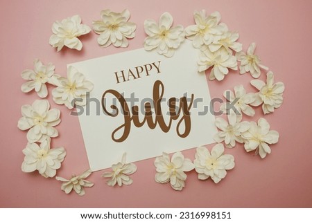 Happy July card typography text with flower bouquet on pink background