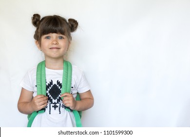 Happy kid with backpack is staying on white background. Ready for school. Back to school. 
