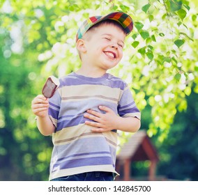 Happy Kid Boy Eating Ice Cream