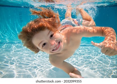 Happy kid boy swim and dive underwater, kid with fun in pool under water. Active healthy lifestyle, water sport activity and swimming lessons on summer vacation with child. - Shutterstock ID 2032099355