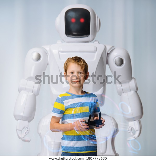 Happy\
kid controls a big robot - future plans for\
college