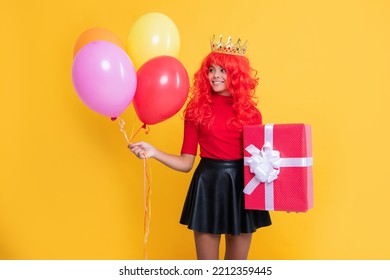 Happy Kid In Crown With Present Box And Party Balloon On Yellow Background