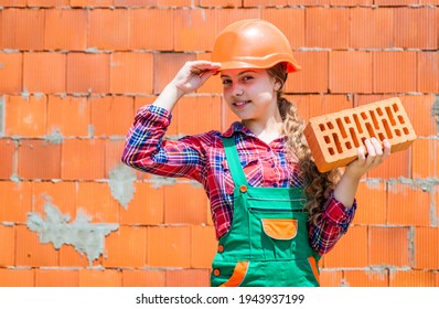 Happy Kid Engineer With Brick In Hard Hat, Bricklayer