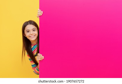 Happy Kid Girl Behind Pink Paper Sheet With Copy Space, Sell Out.