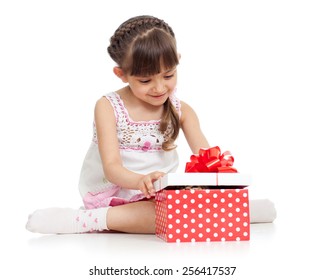 happy kid girl holding gift box isolated on white