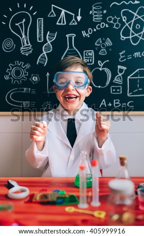 Similar – Kleiner Chemiker in der Brille, der die Kamera ernsthaft ansieht.