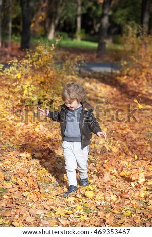 Similar – Image, Stock Photo Cute baby seeing falling leaves