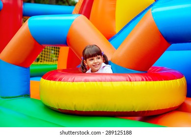 happy kid, having fun on inflatable attraction playground - Shutterstock ID 289125188