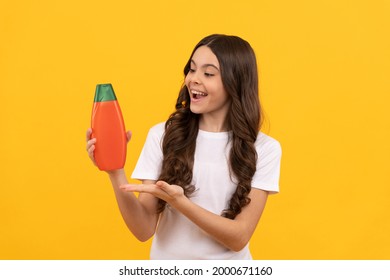 Happy Kid With Long Hair Presenting Product Of Shampoo Bottle, Product Proposal