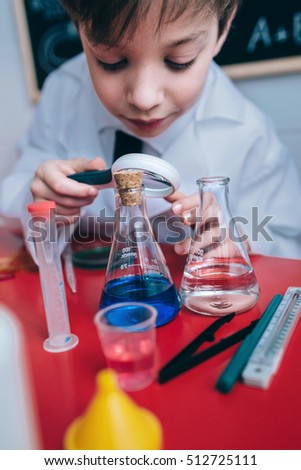 Image, Stock Photo Happy kid looking liquid through magnifying glass