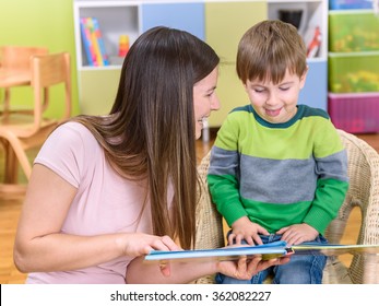 Happy Kid And Mother Reading Picture Book