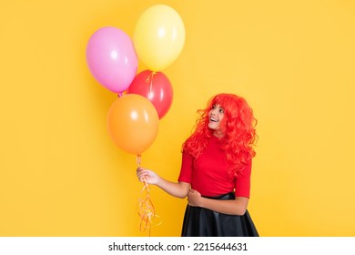 Happy Kid With Party Balloon On Yellow Background