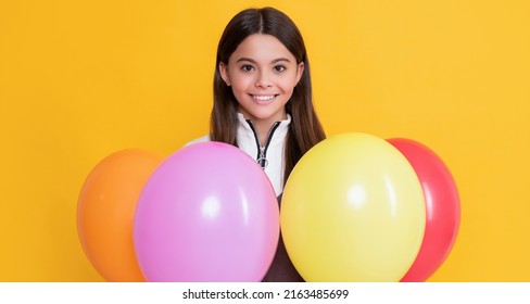 Happy Kid With Party Colorful Balloons On Yellow Background