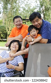 Happy Kid Playing With His Uncle And Aunt