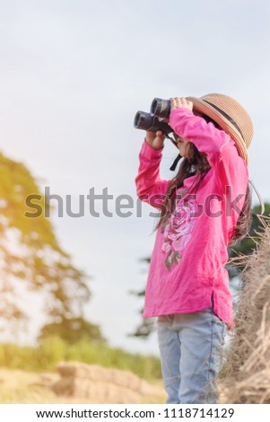 Happy kid playing outdoors. Travel and adventure concept