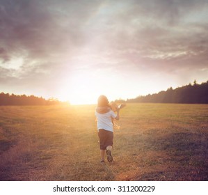 Happy Kid Playing With Paper Airplane