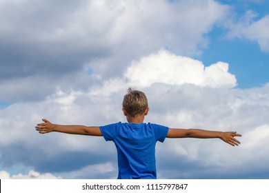 Happy Kid Raised Arms Against Blue Stock Photo 1115797847 | Shutterstock