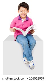 Happy Kid Reading A Book And Smiling - Isolated Over White Background