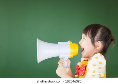 Happy Kid Shouts Something Into The Megaphone