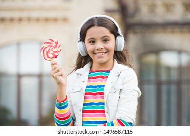 Happy Kid Singing Sweet Candy Mic. Happy Childhood. Kid Child Headphones Holding Lollipop Candy. Happy Kid With Candy Outdoors Having Fun. Calories And Energy. Schoolgirl Deserve Dessert. Sweet Remix.