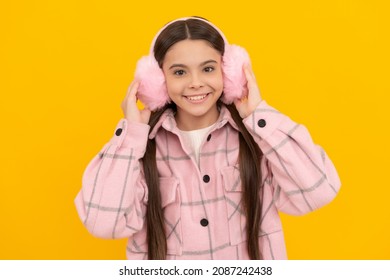 Happy Kid Smile In Warm Winter Wear And Fur Ear Warmers Yellow Background, Earmuffs