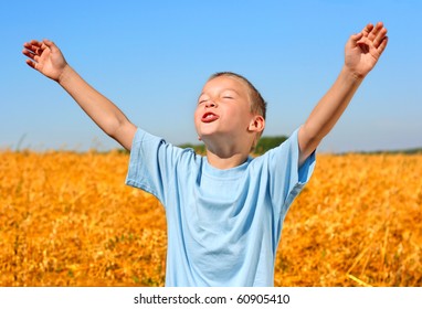 happy kid in wheat field - Powered by Shutterstock