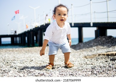 Happy Kid In White Shirt And Blue Shorts.