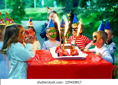 Happy Kids Around Birthday Cake