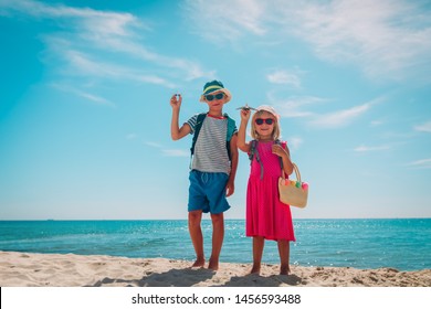happy kids- boy and girl -travel on tropical beach - Shutterstock ID 1456593488