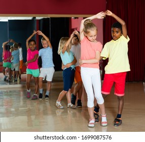 Happy Kids Dancing Salsa Dance In Modern Studio