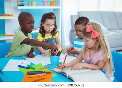 Happy Kids Enjoying Arts And Crafts Together In The Bedroom