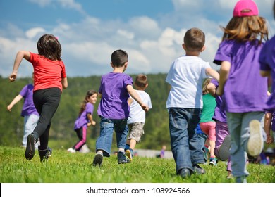 Happy Kids Group Have Fun In Nature Outdoors Park