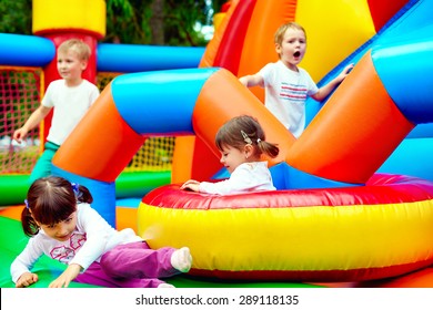 happy kids, having fun on inflatable attraction playground - Shutterstock ID 289118135