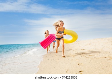 Happy Kids Having A Race On Sunny Beach In Summer