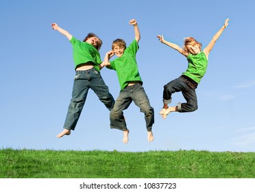 Happy Kids Jumping For Joy