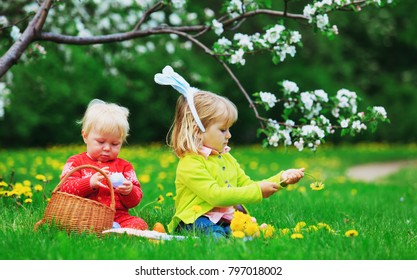 Happy Kids On Easter Eggs Hunt In Spring