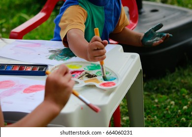 Happy Kids Painting .Activity Outdoor In Summer.
