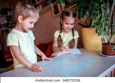 Happy Kids Playing At Board Game Memo In Domestic Interior, Family Values Actually, Stay At Home, Life During Quarantine