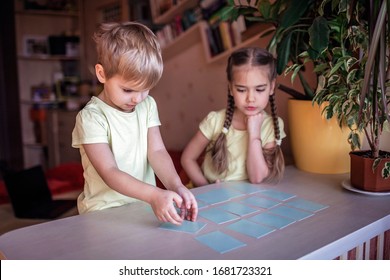 Happy Kids Playing At Board Game Memo In Domestic Interior, Family Values Actually, Stay At Home, Life During Quarantine