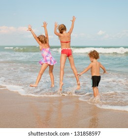 Happy Kids Playing On Beach