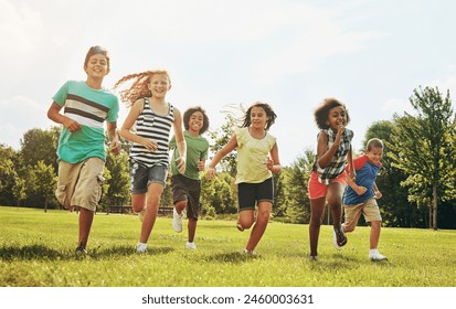 Happy kids, playing and running with grass field in nature for fun, playful day or sunshine at park. Diversity or group of excited children or youth enjoying sunny outdoor holiday or weekend together - Powered by Shutterstock