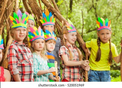 Happy kids playing standing next to wigwam - Powered by Shutterstock