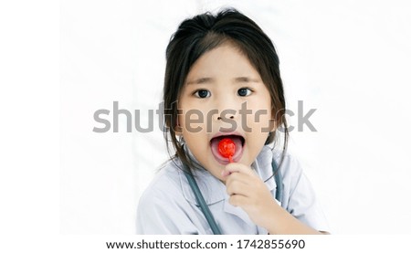 happy kids with red lollipop sweet candy on white background