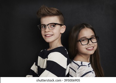 Happy Kids In Studio Shot, Wearing Glasses