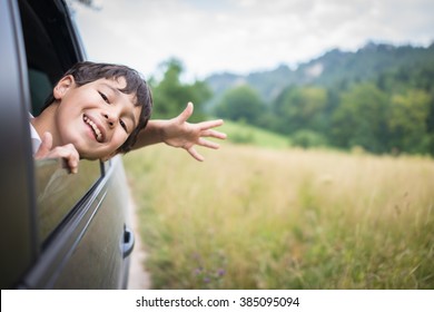 Happy Kids Travel By The Car