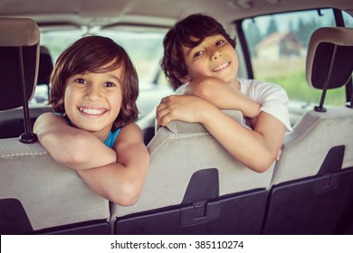 Happy Kids Travel By The Car