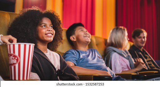 Happy Kids Watching Movie In Theater/theatre Cinema