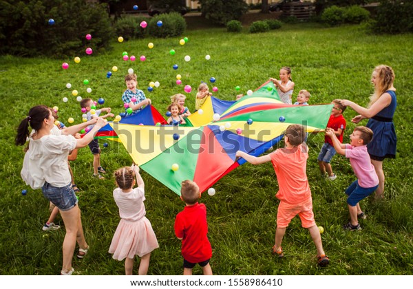 Happy Kids Waving Rainbow Parachute Full Stock Photo 1558986410 ...