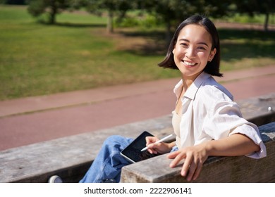 Happy korean woman sitting