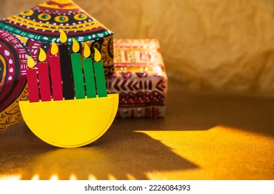 Happy Kwanzaa background with gifts in boxes wrapped in hand-painted paper - Shutterstock ID 2226084393